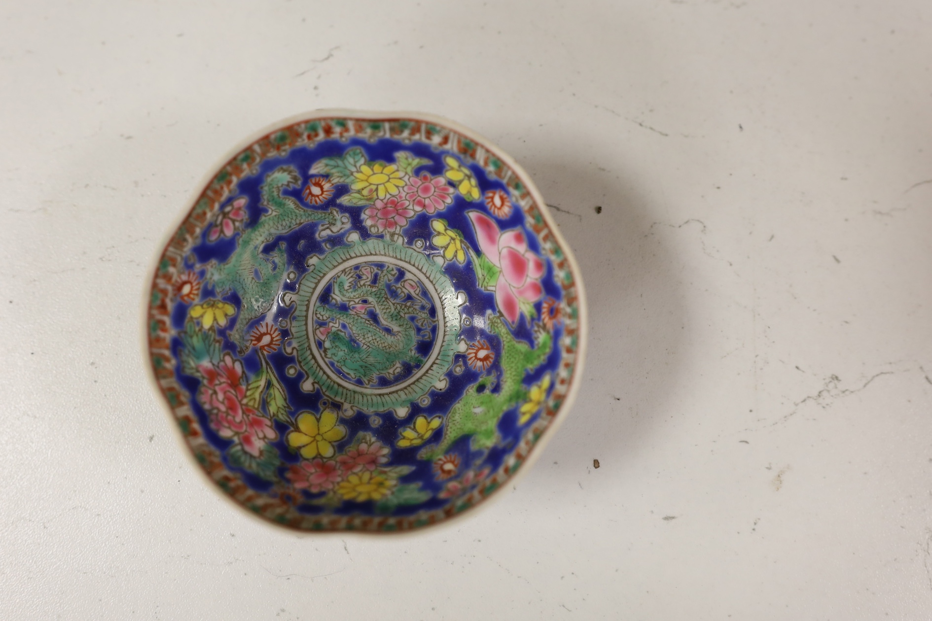 A pair of Chinese enamelled porcelain bowls, an eggshell bowl and a blue and white dragon bowl, turquoise bowls 11cm diameter (4). Condition - fair